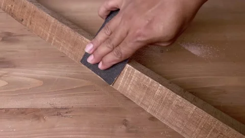 Sanding wooden surface manually using sandpaper Video stock 345587027