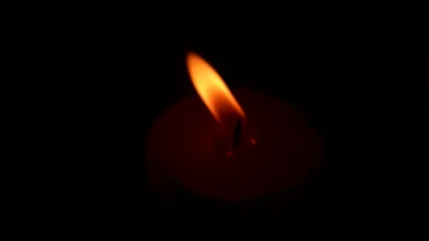 Сandle burning haze, flame red candle against blurred background darkness. Stock Footage 317038740