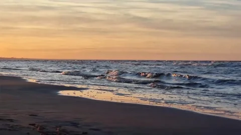 The sands of the Baltic Sea and the waves of the sea at sunset. Latvia, Riga, Bo Stock Footage 301877534
