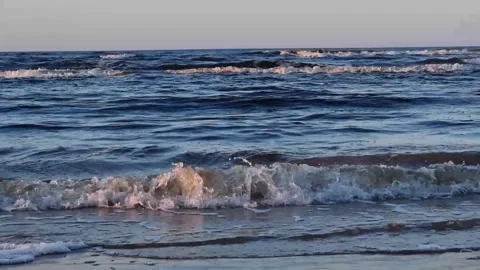 The sands of the Baltic Sea and the waves of the sea at sunset. Latvia, Riga, Bo Stock Footage 301877883
