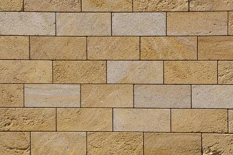 Sandstone brick wall, background, close-up. Eco-friendly construction. 写真素材