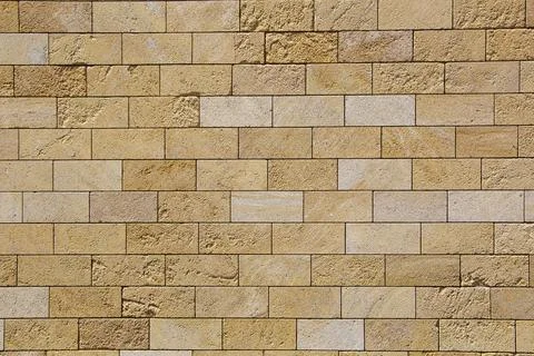 Sandstone brick wall, background, close-up. Eco-friendly construction. Foto stock