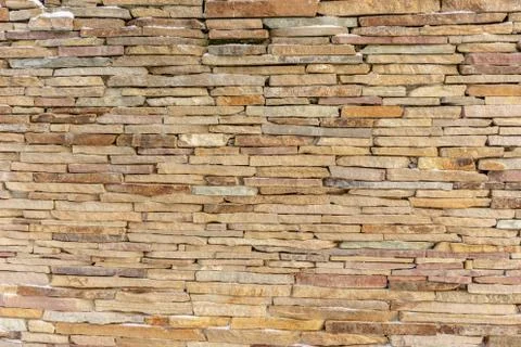 Sandstone brick wall texture background Stock Photos