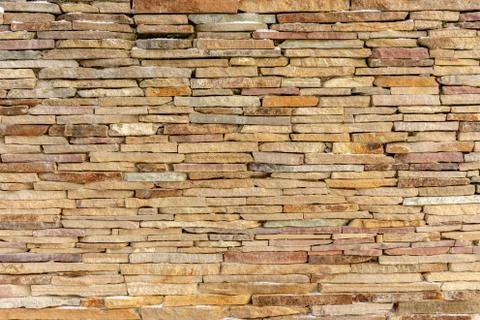Sandstone brick wall texture background design Stock Photos
