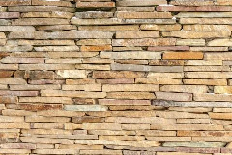 Sandstone brick wall texture background design Stock Photos
