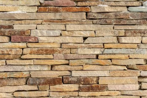 Sandstone brick wall texture background Stock Photos