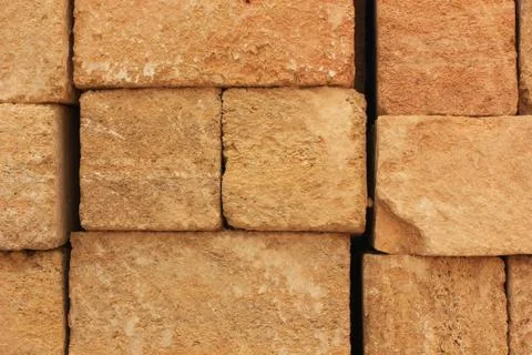 Sandstone bricks stacked in rows Foto stock