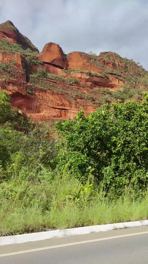 Sandstone cliffs of Chapada dos Guimãraes. Mountain Red Rocks Plateau and Lush Stock Footage 309561249