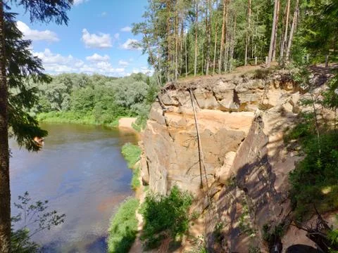 Sandstone cliffs. Erglu Cliffs (Ērgļu klintis), on the bank of the Gauja rive Stock Photos