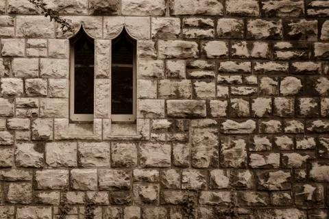 Sandstone wall with two small windows, Sandstein Stock Photos