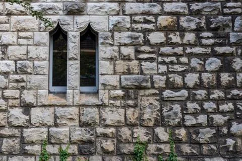 Sandstone wall with two windows, Small Windows , Two windows in a sandstone wall Stock Photos
