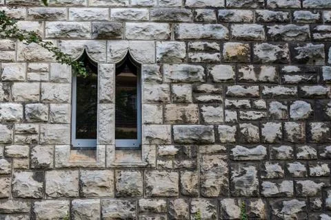 Sandstone wall with two windows, Small Windows , Two windows in a sandstone wall Stock Photos