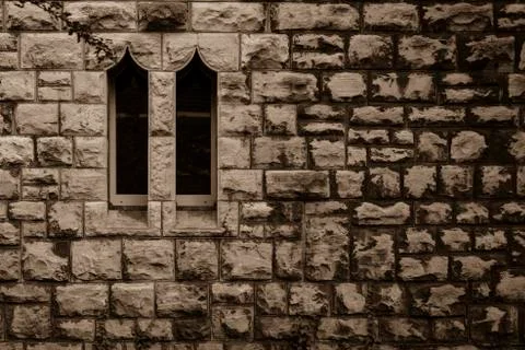 Sandstone wall with two windows, Small Windows , Two windows in a sandstone wall Stock Photos