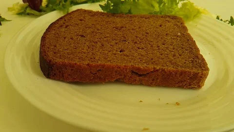 Sandwich black bread drops cheese Stock Footage 87659445
