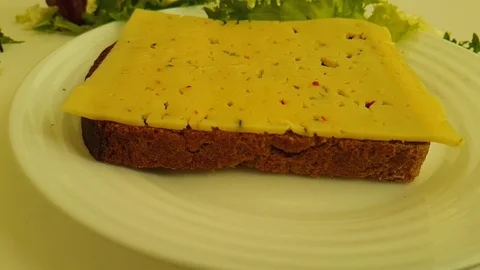Sandwich black bread drops cheese Stock Footage 87659465