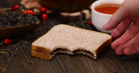 Sandwich of bread and chocolate on the table during the tea party, delicious Stock Footage 294699243