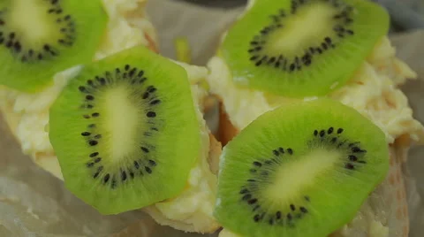 Sandwich with cheese and kiwi paste of garlic and parmesan Stock Footage 64570629