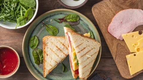 Sandwich with cheese, ham, tomato sauce, с bread, the process of making Stock Footage 129704559