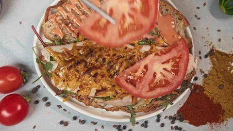 Sandwich with combination of processed cheese, meat, and vegetables. garnished Stock Footage 292154289