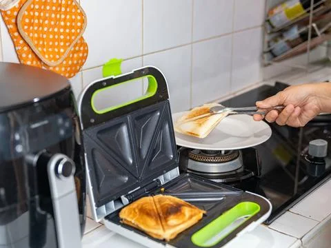 The sandwich is done baking and is placed on a plate. Stock Photos