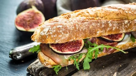 Sandwich with figs and prosciutto Stock Photos