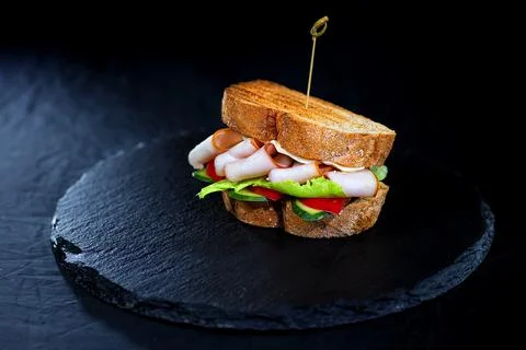 Sandwich with hamon on black background Stock Photos
