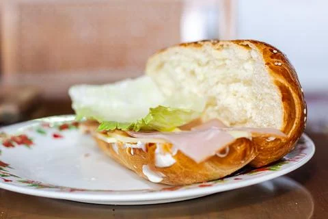 Sandwich with open bread with cheese ham lettuce and mayonnaise on a plate .. Stock Photos