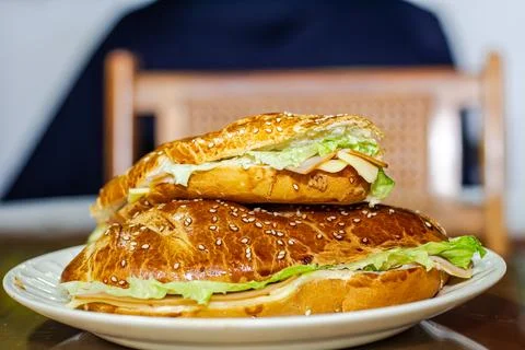 Sandwich with open bread with cheese ham lettuce and mayonnaise on a plate .. Stock Photos