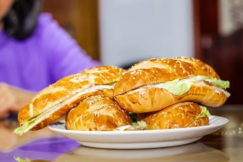 Sandwich with open bread with cheese ham lettuce and mayonnaise on a plate .. Stock Photos