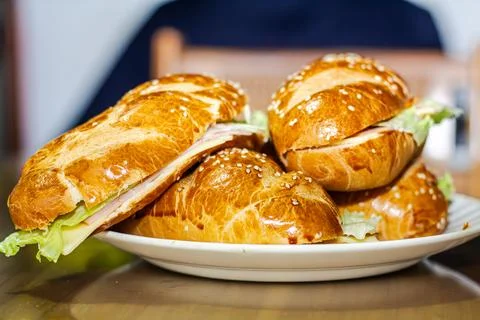 Sandwich with open bread with cheese ham lettuce and mayonnaise on a plate .. Stock Photos