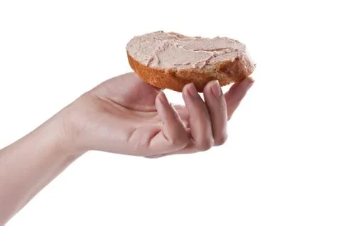 Sandwich with paste in a hand Stock Photos
