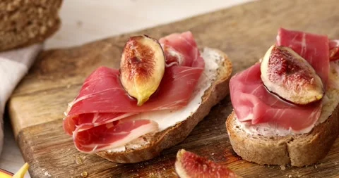 Sandwich with prosciutto and figs. Stock Footage 249334529