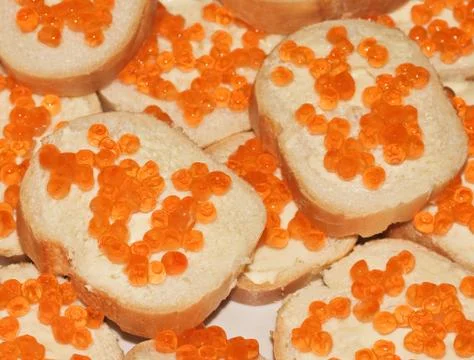 Sandwich with red caviar Stock Photos