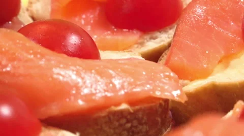 Sandwich with red fish, white bread and cherry tomatoes Stock Footage 47209184