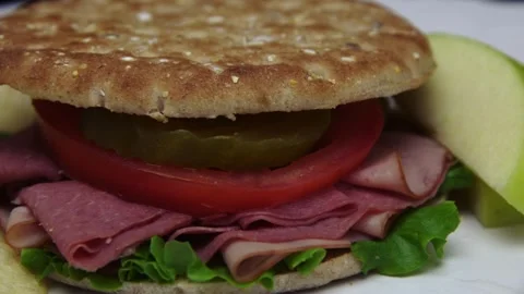 Sandwich with a Slim Bread and an apple on the side Stock Footage 243620808