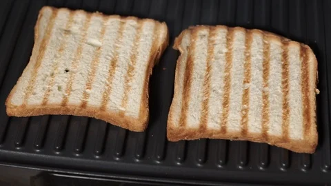 Sandwich toaster with fried bread close-up Stock Footage 119071048