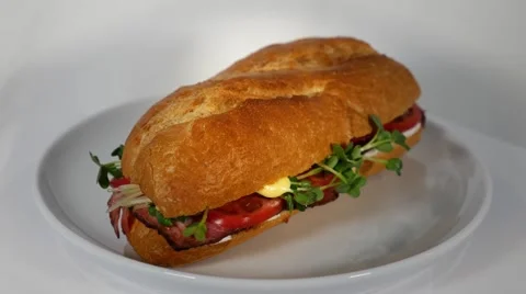 Sandwich turning on a rotary table Stock Footage 48920063