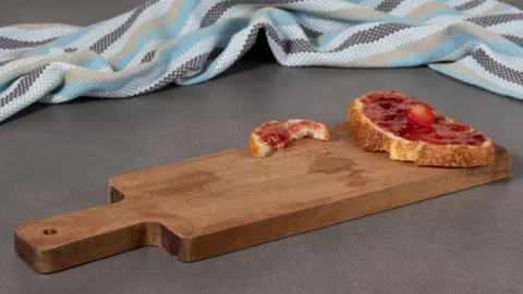 Sandwiches with bread and strawberry jam. Stop motion animation Stock Footage 287724610