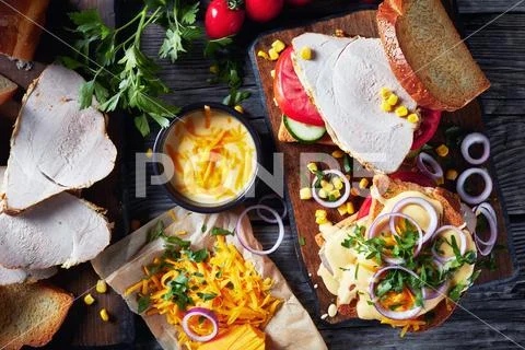 Sandwiches with juicy slices of ham and veggies Stock Photos