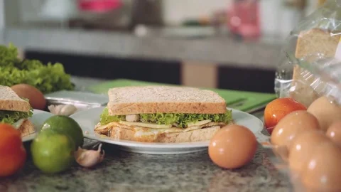 Sandwiches just prepared on kitchen, between ingredients 動画素材 77900482