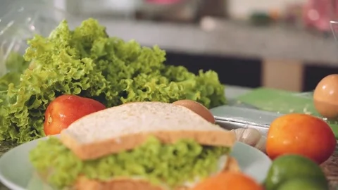 Sandwiches just prepared on kitchen, between ingredients Stock Footage 77900487