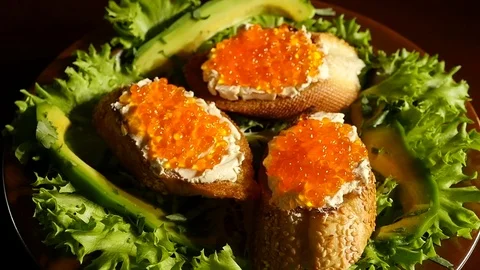 Sandwiches with red caviar on a plate Stock Footage