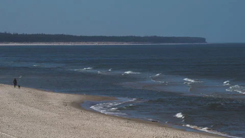 Sandy and stone coast with long waves in Kolobrzeg resort city in Poland. Video stock 237372837
