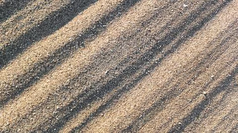 Sandy background with diagonal stripes Stock Photos