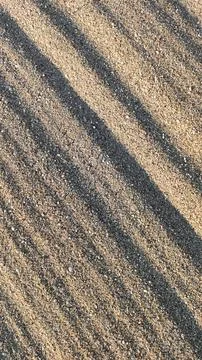 Sandy background with diagonal stripes, vertical frame Foto stock