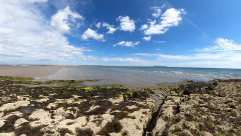 Sandy beach and archs with green moss on the daytime. Stock Footage 158576353