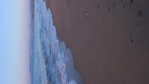 Sandy beach and blue waves of the sea Stock Footage 242907066