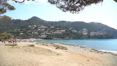 Sandy beach and mountain long shot Stock Footage 128349467