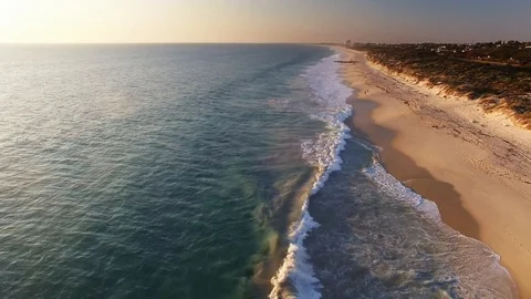 Sandy beach and ocean afternoon flyover 4k - Perth, Australia Stock Footage