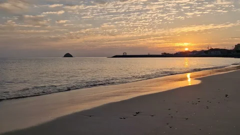 Sandy beach and ocean surf at sunset. Stock Footage 295752592